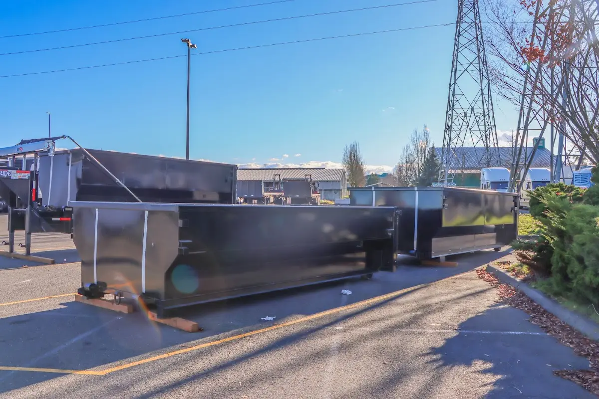 Roll-off dumpster ready for waste disposal at job site for Concrete Dumpster Rental in Forsyth